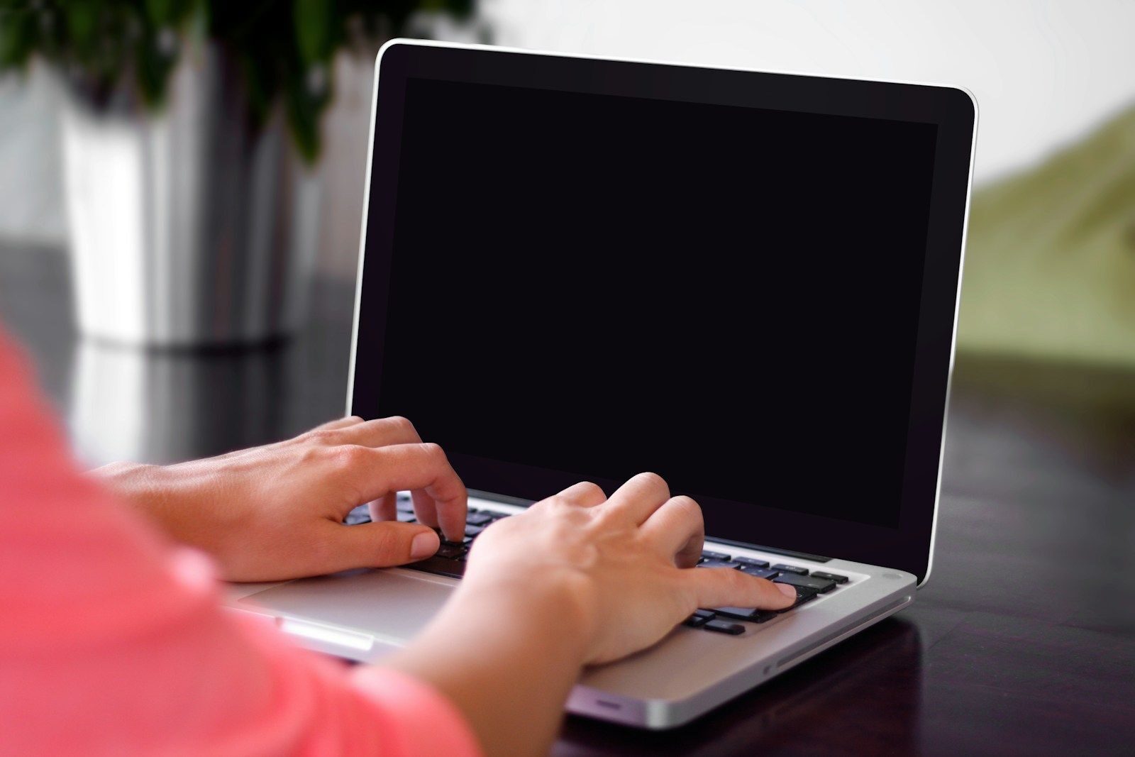 contacter la mairie person wearing pink shirt typing on gray laptop computer on desk