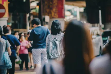 service population woman standing in the middle of crowd