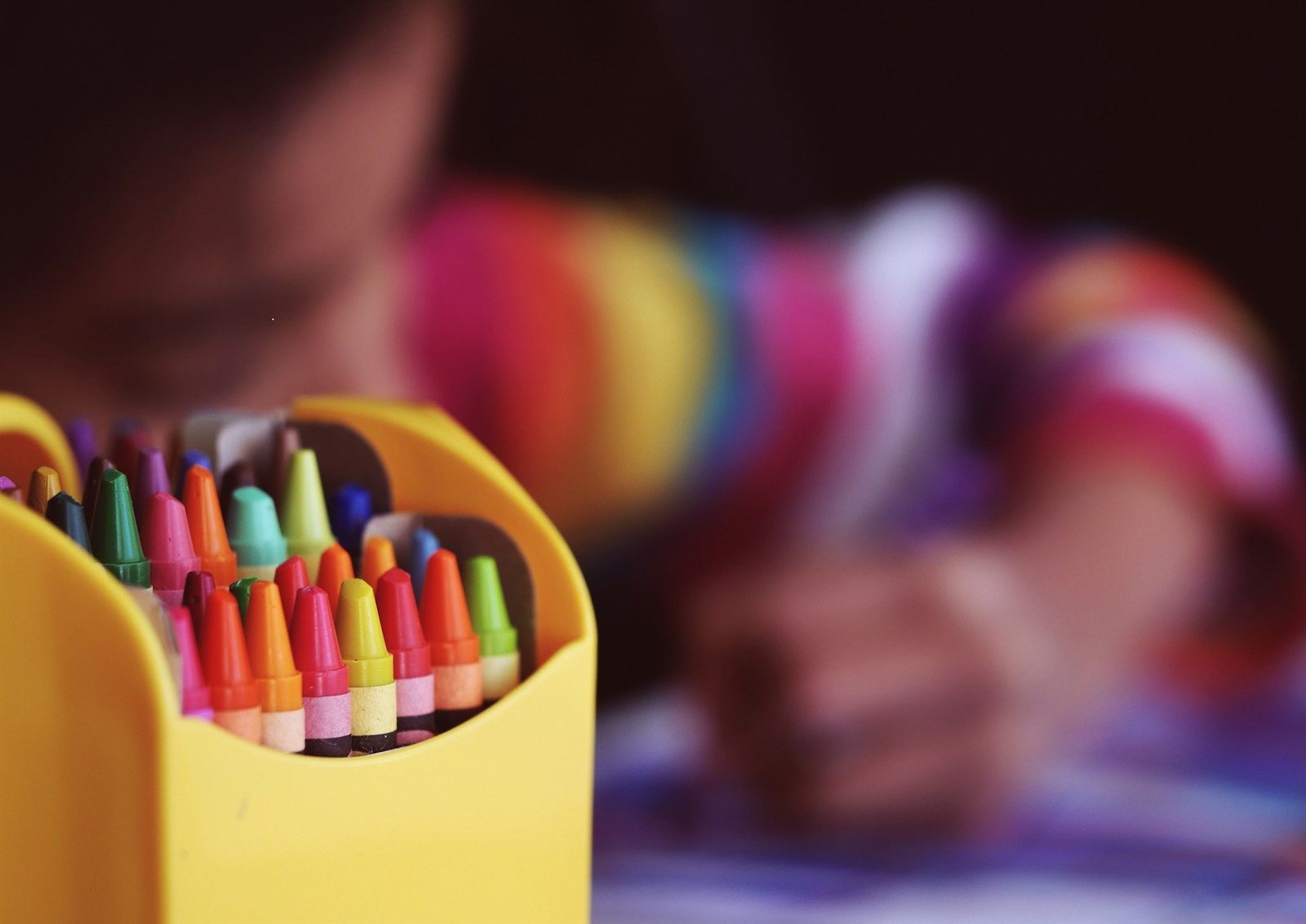 centre de loisirs selective focal photo of crayons in yellow box