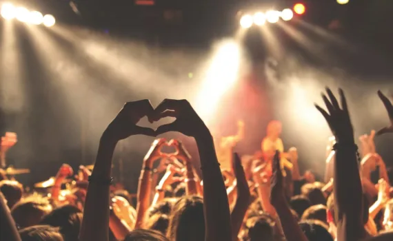 person performing heart hand gesture