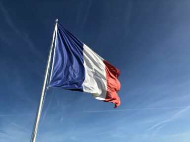 cérémonie french flag under blue sky
