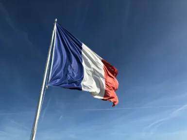 cérémonie french flag under blue sky