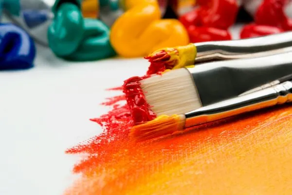 amea three silver paint brushes on white textile