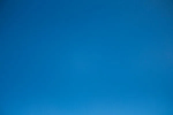 A clear and cloudless bright blue sky